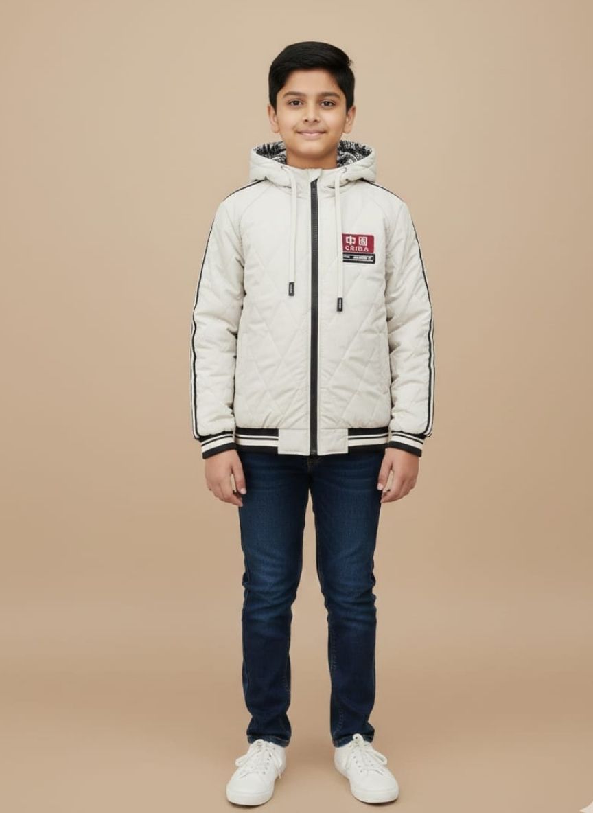 Dark blue or black luxury knit beanie with an intricate cable pattern and a gold Medusa head emblem on the ribbed cuff.