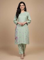 Women's pista green 2 piece hand painted cotton suit with butterfly artClose-up of hand-painted pink flowers and butterflies on cotton fabricPista green cotton shirt with sequin embellishments and hand paintingArtisan crafted hand painted 2 piece ethnic wear for ladies in PakistanPure cotton hand painted women's suit in pista green for casual wear 2 pc hand painted cotton suit Pakistan