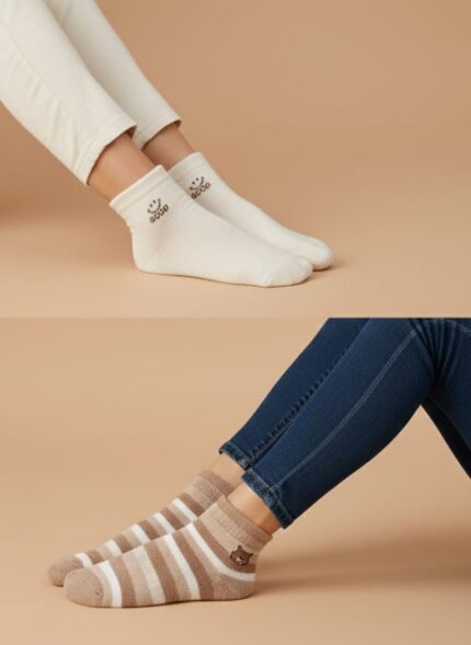 Set of three women's cute ankle socks in beige, white, and striped brown designs, each with a playful motif like a bear or a smiley face slogan.