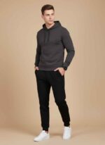 Main View: Gelani's black whool trouser for men featuring a tapered jogger fit and elastic waistband. Detail View: Close-up of the drawstring waistband and subtle logo on the men's black winter wool trousers. Cuff Detail: Ribbed ankle cuffs on a stitched black wool trouser for thermal heat retention. Fabric View: High-quality black wool-blend fabric texture for men's winter legwear. Pocket View: Deep side pocket detail on the men's black quilted-style wool joggers. whool trouser for men