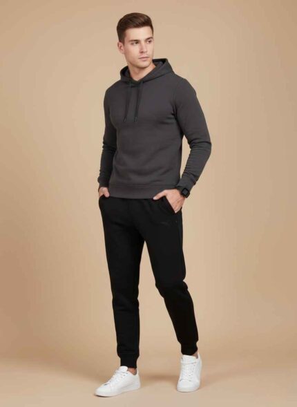 Main View: Gelani's black whool trouser for men featuring a tapered jogger fit and elastic waistband. Detail View: Close-up of the drawstring waistband and subtle logo on the men's black winter wool trousers. Cuff Detail: Ribbed ankle cuffs on a stitched black wool trouser for thermal heat retention. Fabric View: High-quality black wool-blend fabric texture for men's winter legwear. Pocket View: Deep side pocket detail on the men's black quilted-style wool joggers. whool trouser for men