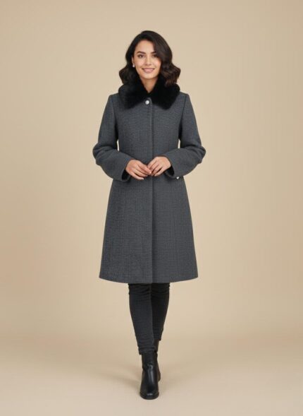 Product photo of a relaxed-fit beige V-neck knit coat with a chunky texture, four brown buttons, and two patch pockets.