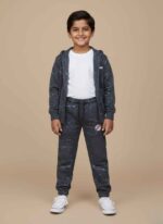 Kids-blue-terry-winter-trousers-galaxy-printDark-blue-kids-joggers-with-white-splatter-designClose-up-of-terry-fabric-and-Kids-winter-wear-trousers-with-ankle-cuffs-detail Side-profile-of-blue-printed-trousers-for-kidsKids Blue Terry Winter Trousers in Pakistan