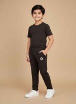 Boys black fleece joggers with elastic waistband for winter. Gelani's navy blue stitched fleece trousers for kids. Warm red fleece trouser for boys with side pocket detail. Light gray athletic fleece pants for young boys in Pakistan. Close-up of the soft fleece interior and stitching on boys' winter trousers. fleece trouser for boys