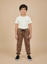 Kids-brown-terry-trousers-front-viewSoft-terry-fabric-texture-detail-brownElastic-waistband-with-black-drawstring-trousersKids-jogger-pants-ribbed-ankle-cuffsSide-graphic-logo-design-on-kids-trousersKids Brown Terry Trousers in Pakistan