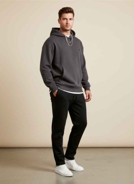 Gelani's men's black wool winter trousers side view. Off-white stitched wool trousers for men flat lay. Close-up of premium wool fabric texture on men's winter pants. Men's formal winter trousers in black color size 32. Gelani's winter collection wool trousers displayed on a background. whool trouser for men