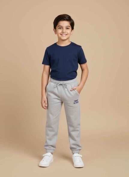 Boys black fleece joggers with elastic waistband and brand logo. Gelani's navy blue stitched fleece trousers for kids winter wear. Light gray athletic fleece trouser for boys with comfortable drawstring. Detailed shot of soft fleece interior and ribbed ankle cuffs on boys' joggers. Versatile winter fleece trousers for boys available in sizes 18 to 24. Boys black fleece joggers with elastic waistband and brand logo. Gelani's navy blue stitched fleece trousers for kids winter wear. Light gray athletic fleece trouser for boys with comfortable drawstring. Detailed shot of soft fleece interior and ribbed ankle cuffs on boys' joggers. Versatile winter fleece trousers for boys available in sizes 18 to 24.